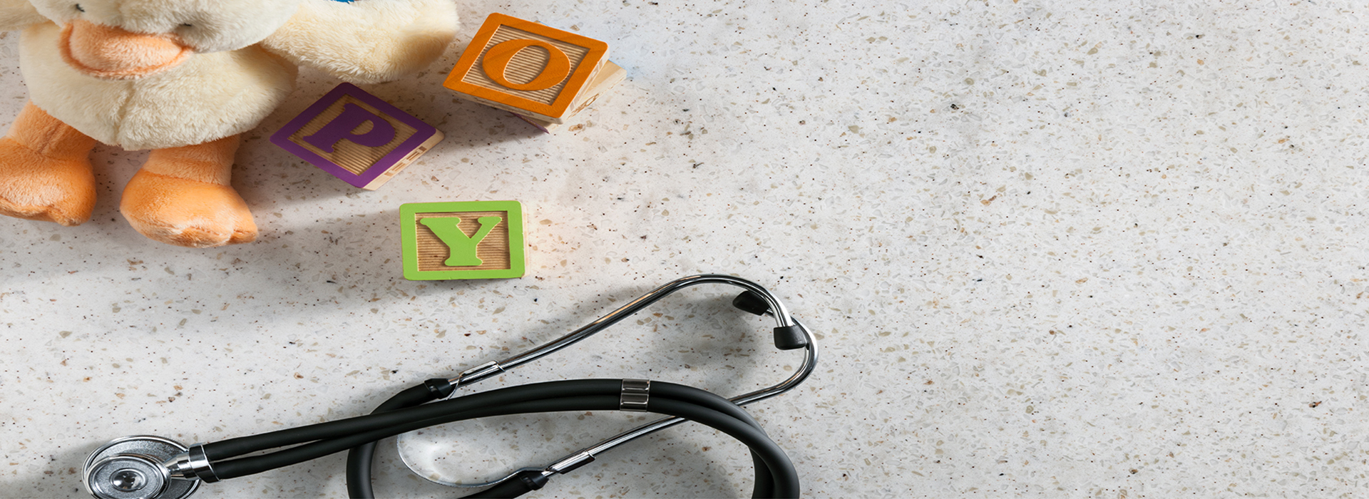 Building blocks and stethoscope 788 White Travertine Formica Solid Surfacing